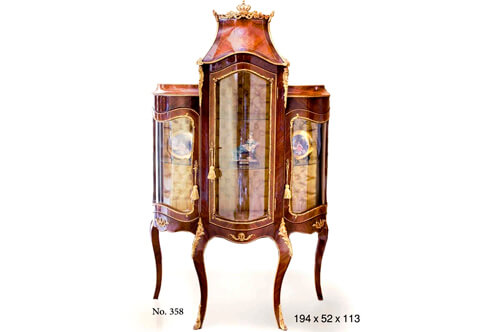 A Royal French Napoleon III Louis XV Revival style ormolu-mounted veneer inlaid upholstered three doors Vitrine Showcase